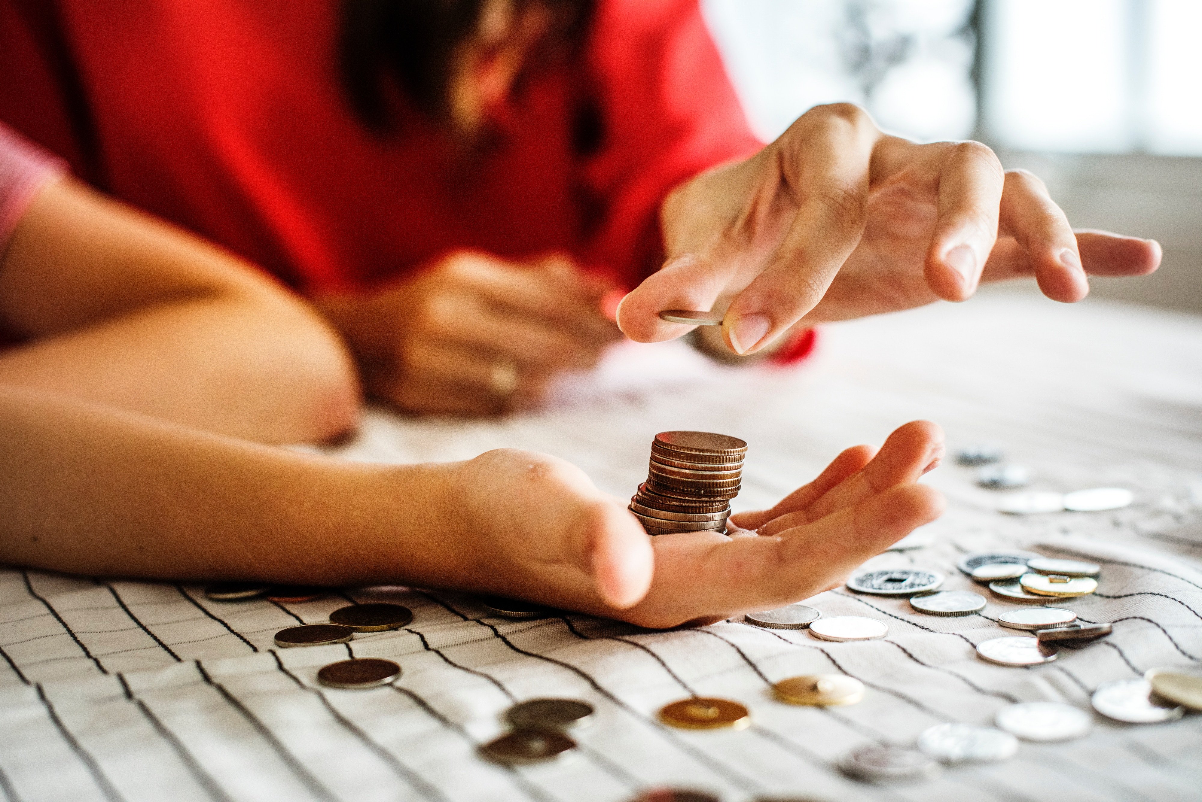 People counting money for Christmas budget travel tips